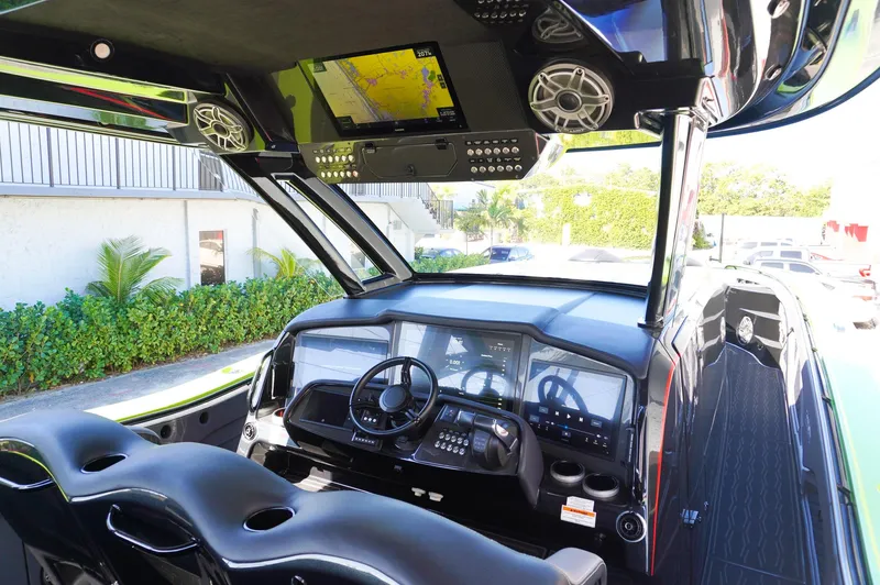  Yacht Photos Pics 2022 MTI 50V Center Console boat interior with advanced navigation system and sleek design.