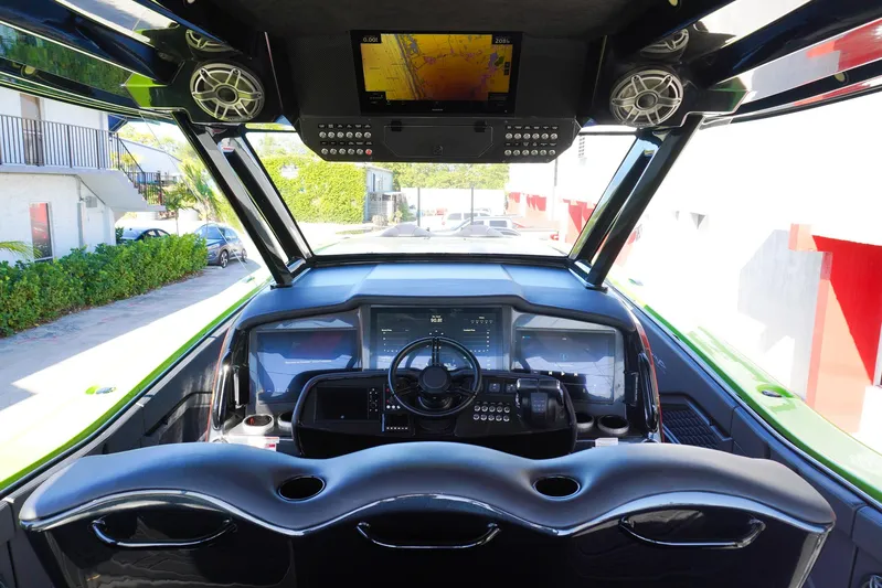  Yacht Photos Pics 2022 MTI 50V Center Console boat interior with advanced navigation system and sleek design.