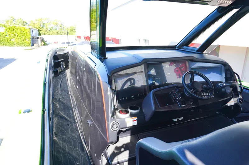  Yacht Photos Pics 2022 MTI 50V Center Console boat interior with modern dashboard and steering wheel.