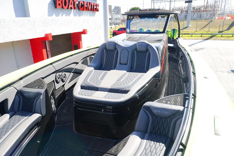  Yacht Photos Pics 2022 MTI 50V Center Console boat with luxurious seating at a boat center.