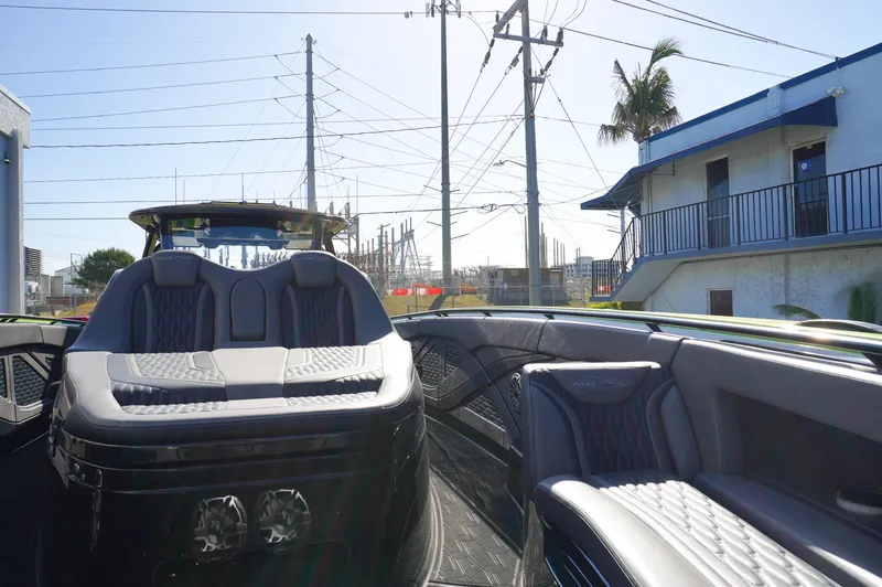  Yacht Photos Pics 2022 MTI 50V Center Console boat with luxurious seating and modern design.