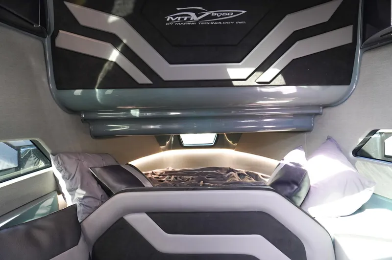  Yacht Photos Pics 2022 MTI 50V Center Console cabin interior with modern design and comfortable bedding.