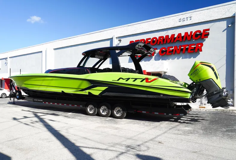  Yacht Photos Pics 2022 MTI 50V Center Console boat in vibrant green at Performance Center.