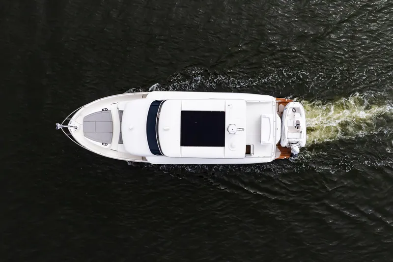 The Transporter Yacht Photos Pics Overhead view of 2023 Absolute 52 Navetta yacht cruising on water.