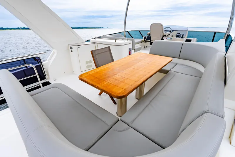 The Transporter Yacht Photos Pics Luxurious seating area on 2023 Absolute 52 Navetta yacht with ocean view.