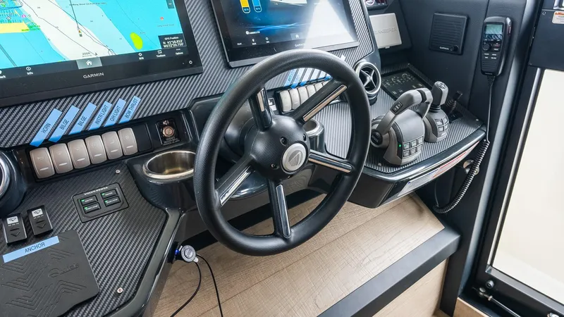 The Transporter Yacht Photos Pics Cockpit of 2023 Absolute 52 Navetta yacht with advanced navigation controls and displays.