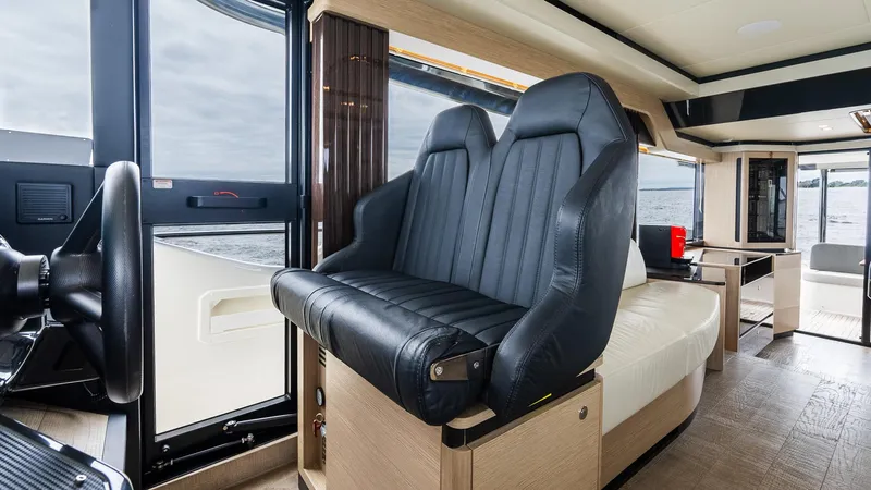The Transporter Yacht Photos Pics Interior of 2023 Absolute 52 Navetta yacht with luxurious seating and modern design.