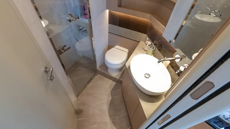The Transporter Yacht Photos Pics Luxurious bathroom in 2023 Absolute 52 Navetta yacht with modern fixtures and elegant design.