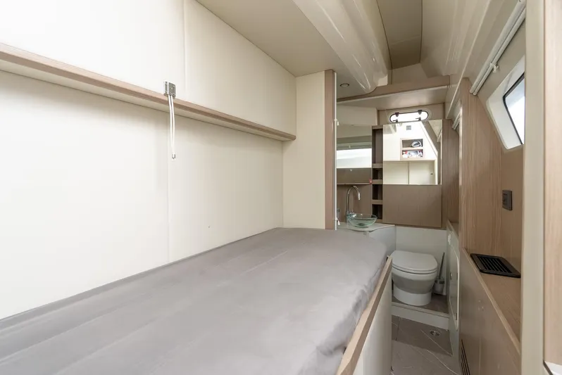 The Transporter Yacht Photos Pics 2023 Absolute 52 Navetta yacht interior with bed and bathroom.