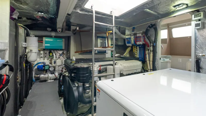 The Transporter Yacht Photos Pics Engine room of 2023 Absolute 52 Navetta yacht, featuring modern equipment and organized layout.