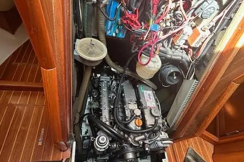 Nonna Yacht Photos Pics Engine compartment of a 2005 Jeanneau Deck Salon 43 sailboat, showcasing detailed mechanical components.