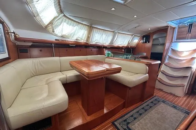 Nonna Yacht Photos Pics 2005 Jeanneau Deck Salon 43 interior with elegant wood finish and plush seating.