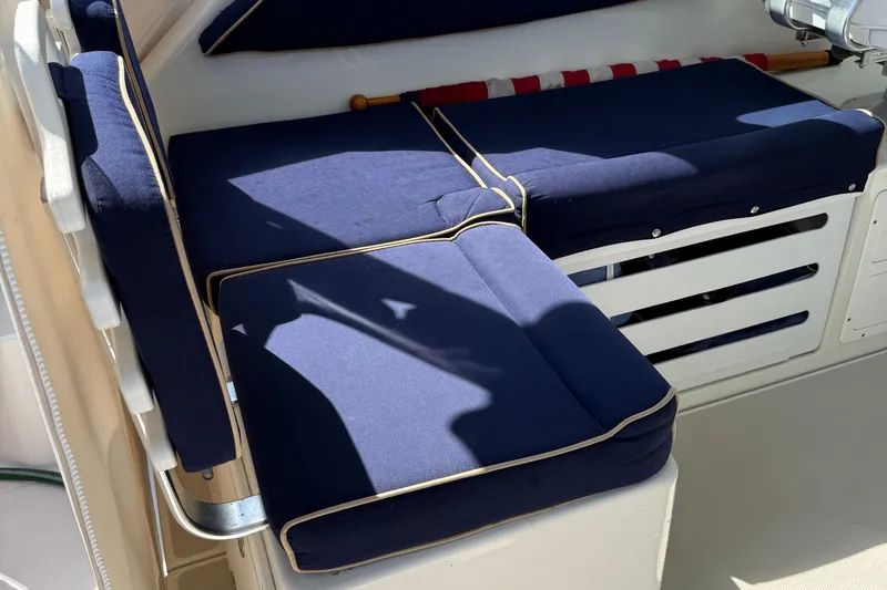 Eventide Yacht Photos Pics 2007 Back Cove 29 boat interior with blue cushioned seating.
