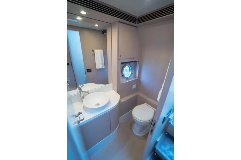  Yacht Photos Pics Luxurious bathroom interior of 2015 Riva 63 Virtus yacht with modern fixtures.