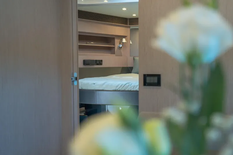  Yacht Photos Pics Luxurious interior of 2015 Riva 63 Virtus yacht, featuring elegant bedroom design.