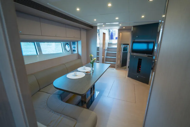  Yacht Photos Pics Luxurious interior of 2015 Riva 63 Virtus yacht with elegant dining area and modern amenities.