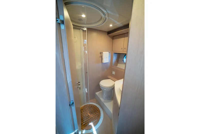  Yacht Photos Pics Luxurious bathroom interior of 2015 Riva 63 Virtus yacht, featuring modern fixtures and elegant design.