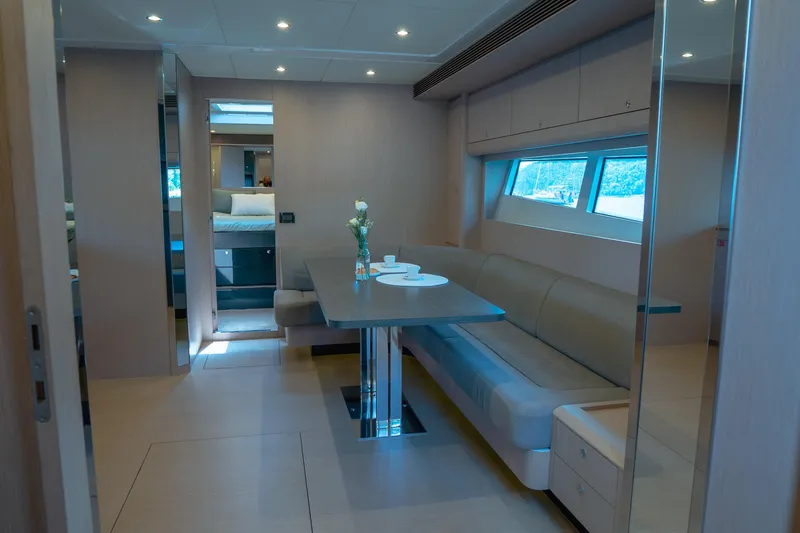  Yacht Photos Pics Luxurious interior of 2015 Riva 63 Virtus yacht with elegant dining area.