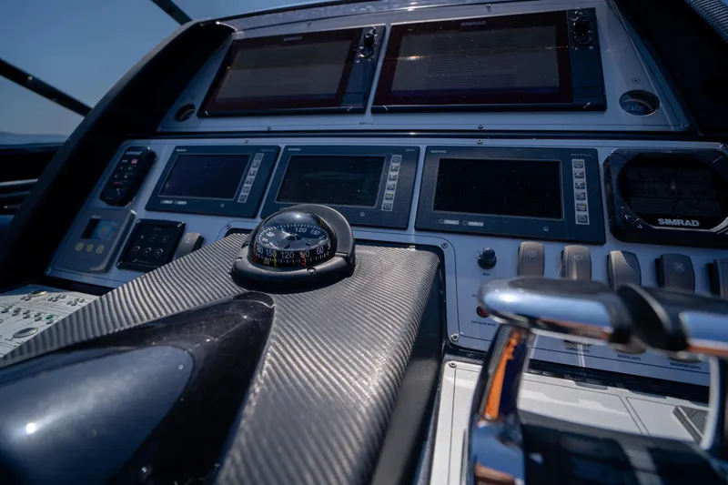  Yacht Photos Pics Cockpit of 2015 Riva 63 Virtus yacht with navigation instruments and controls.