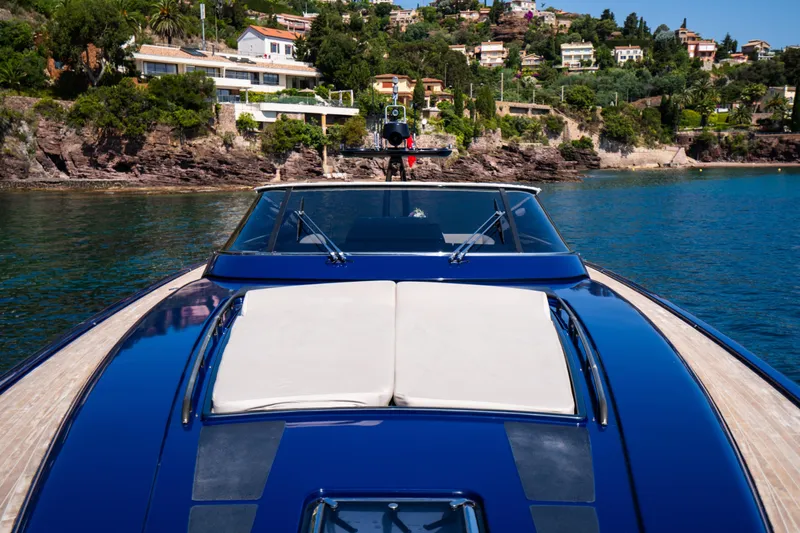  Yacht Photos Pics Luxurious 2015 Riva 63 Virtus yacht cruising near scenic coastal villas.