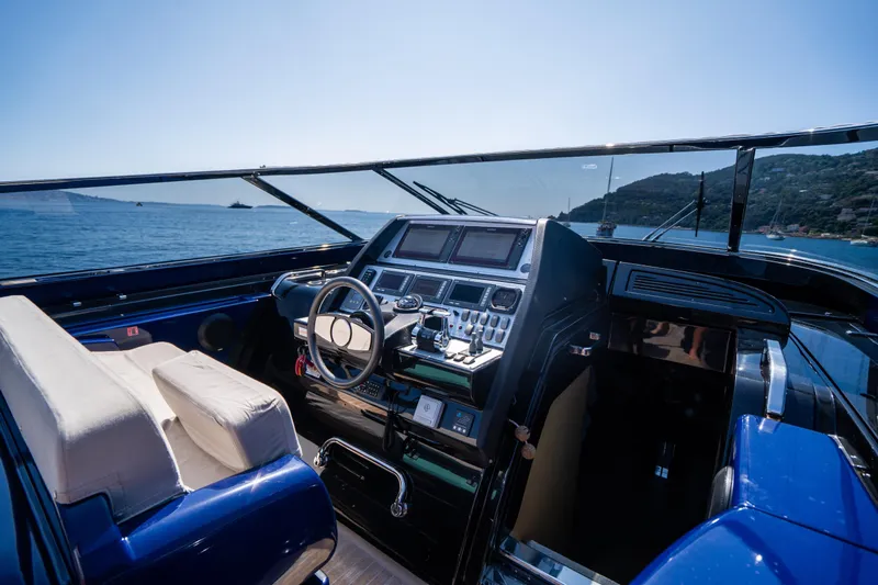  Yacht Photos Pics Cockpit of 2015 Riva 63 Virtus yacht with luxurious controls and scenic ocean view.