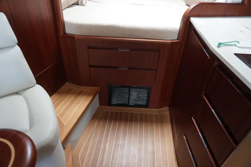  Yacht Photos Pics Interior of 2021 Jupiter 41 SB yacht with wooden cabinetry and flooring.