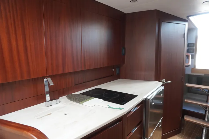  Yacht Photos Pics Luxurious kitchen interior of 2021 Jupiter 41 SB yacht with modern appliances.