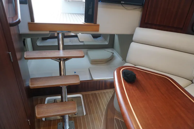  Yacht Photos Pics Interior of 2021 Jupiter 41 SB yacht with wooden stairs and seating area.