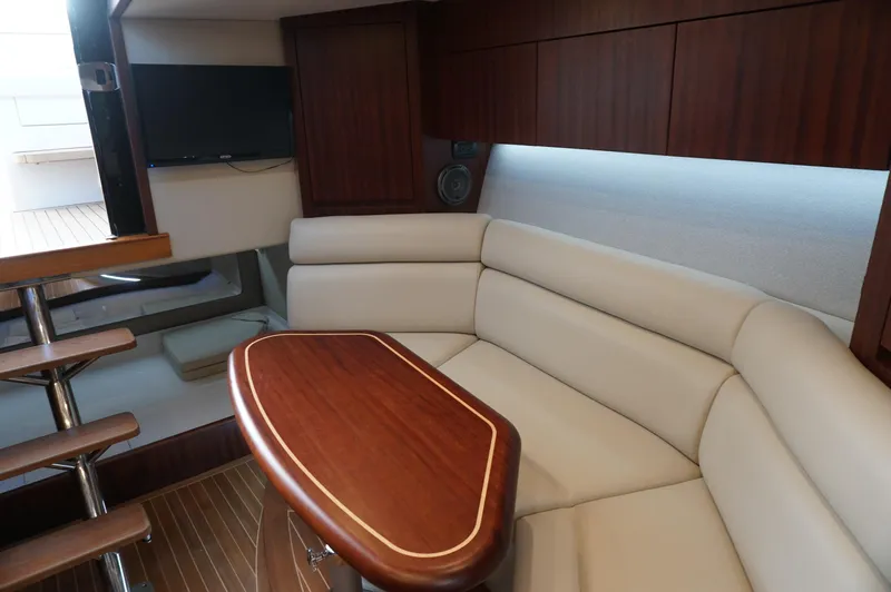  Yacht Photos Pics Interior of 2021 Jupiter 41 SB yacht with elegant seating and wooden table.