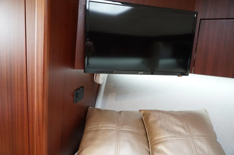  Yacht Photos Pics Interior of 2021 Jupiter 41 SB with TV and cushions.