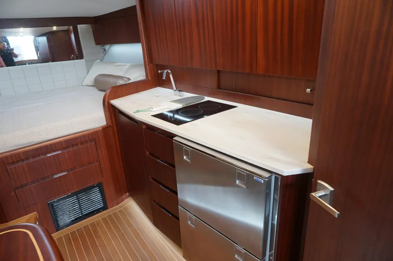  Yacht Photos Pics Interior of 2021 Jupiter 41 SB yacht with kitchen and sleeping area.