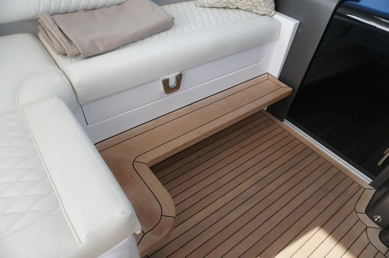  Yacht Photos Pics Interior of 2021 Jupiter 41 SB yacht with wooden flooring and white upholstery.