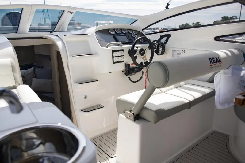  Yacht Photos Pics Interior of a 2023 Real 35 Special Deck (SD) boat with modern steering console.