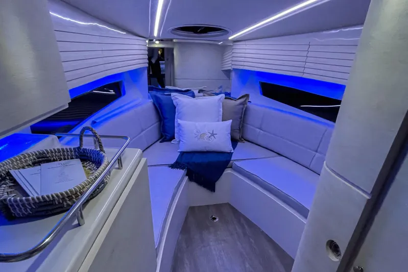 Yacht Photos Pics Luxurious interior of 2023 Real 35 Special Deck (SD) boat with blue LED lighting.