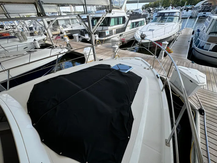 Yacht Rock Yacht Photos Pics 2015 Cruisers Yachts 390 Express Coupe docked among other boats.