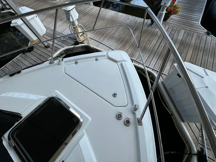 Yacht Rock Yacht Photos Pics 2015 Cruisers Yachts 390 Express Coupe docked, showcasing sleek deck design and stainless steel railings.