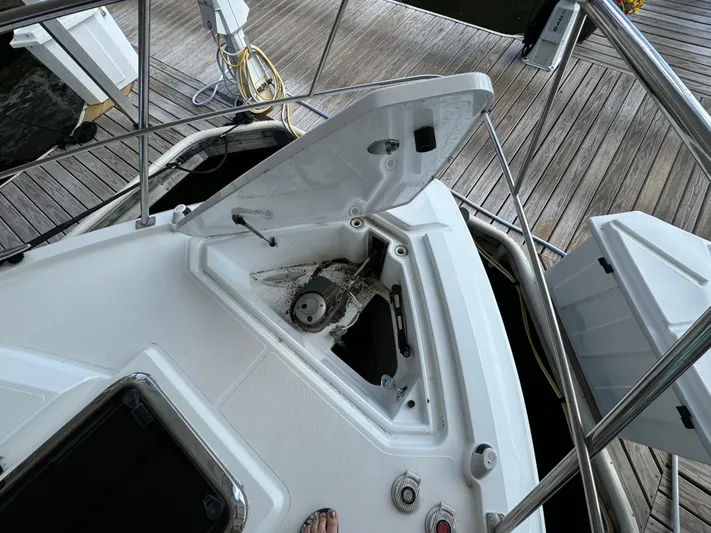 Yacht Rock Yacht Photos Pics 2015 Cruisers Yachts 390 Express Coupe anchor compartment on a wooden dock.