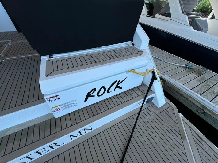 Yacht Rock Yacht Photos Pics 2015 Cruisers Yachts 390 Express Coupe docked, featuring teak decking and "ROCK" lettering.
