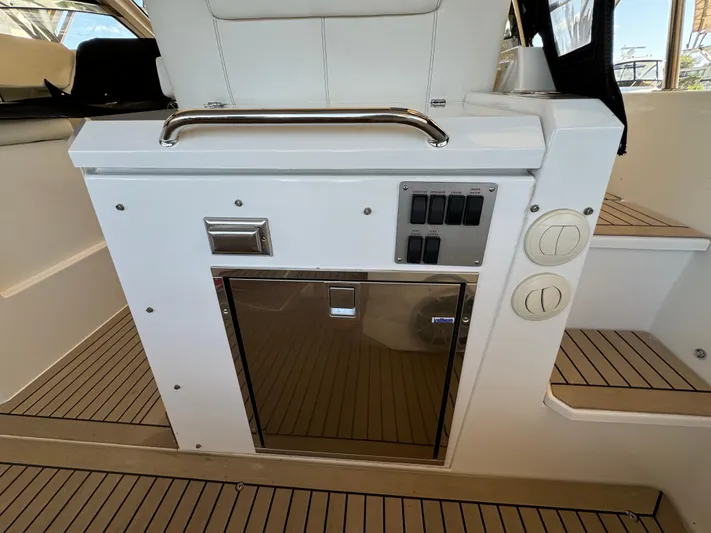Yacht Rock Yacht Photos Pics 2015 Cruisers Yachts 390 Express Coupe interior with control panel and storage.
