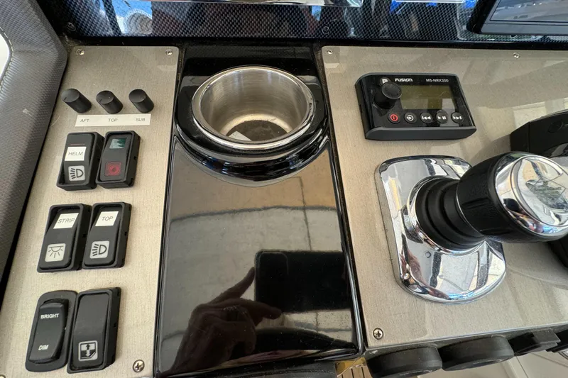 Yacht Rock Yacht Photos Pics Control panel of 2015 Cruisers Yachts 390 Express Coupe with switches and joystick.