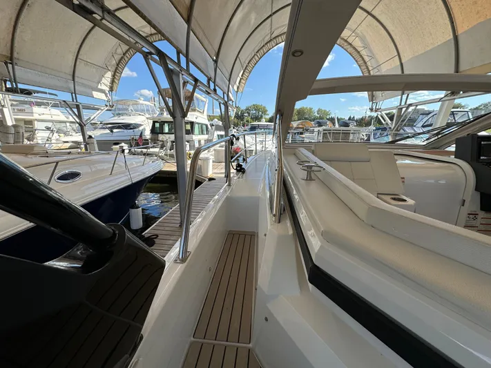 Yacht Rock Yacht Photos Pics 2015 Cruisers Yachts 390 Express Coupe docked, showcasing sleek design and spacious deck area.
