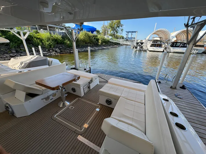 Yacht Rock Yacht Photos Pics 2015 Cruisers Yachts 390 Express Coupe, spacious deck with seating, docked at marina.