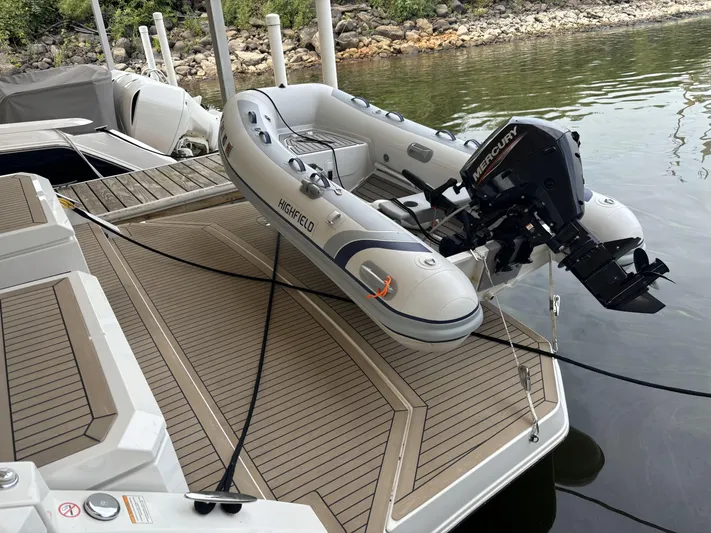 Yacht Rock Yacht Photos Pics Inflatable boat with outboard motor on 2015 Cruisers Yachts 390 Express Coupe deck.