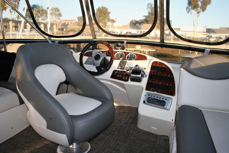 Embracing Life Yacht Photos Pics 2004 Meridian 459 Motoryacht helm with modern controls and comfortable seating.
