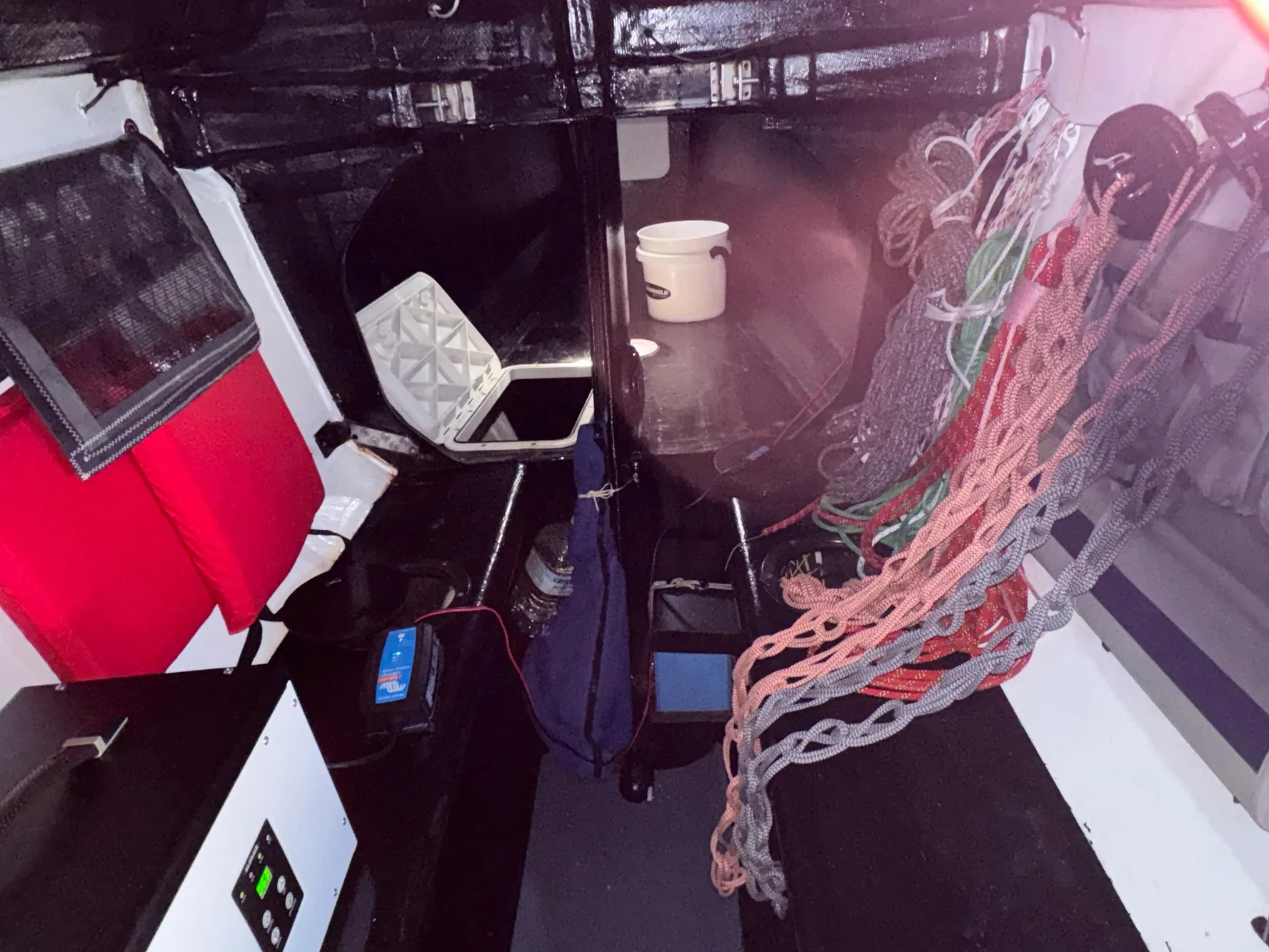 Interior of a 2015 Marstrom Seacart 30 sailboat with ropes and equipment.