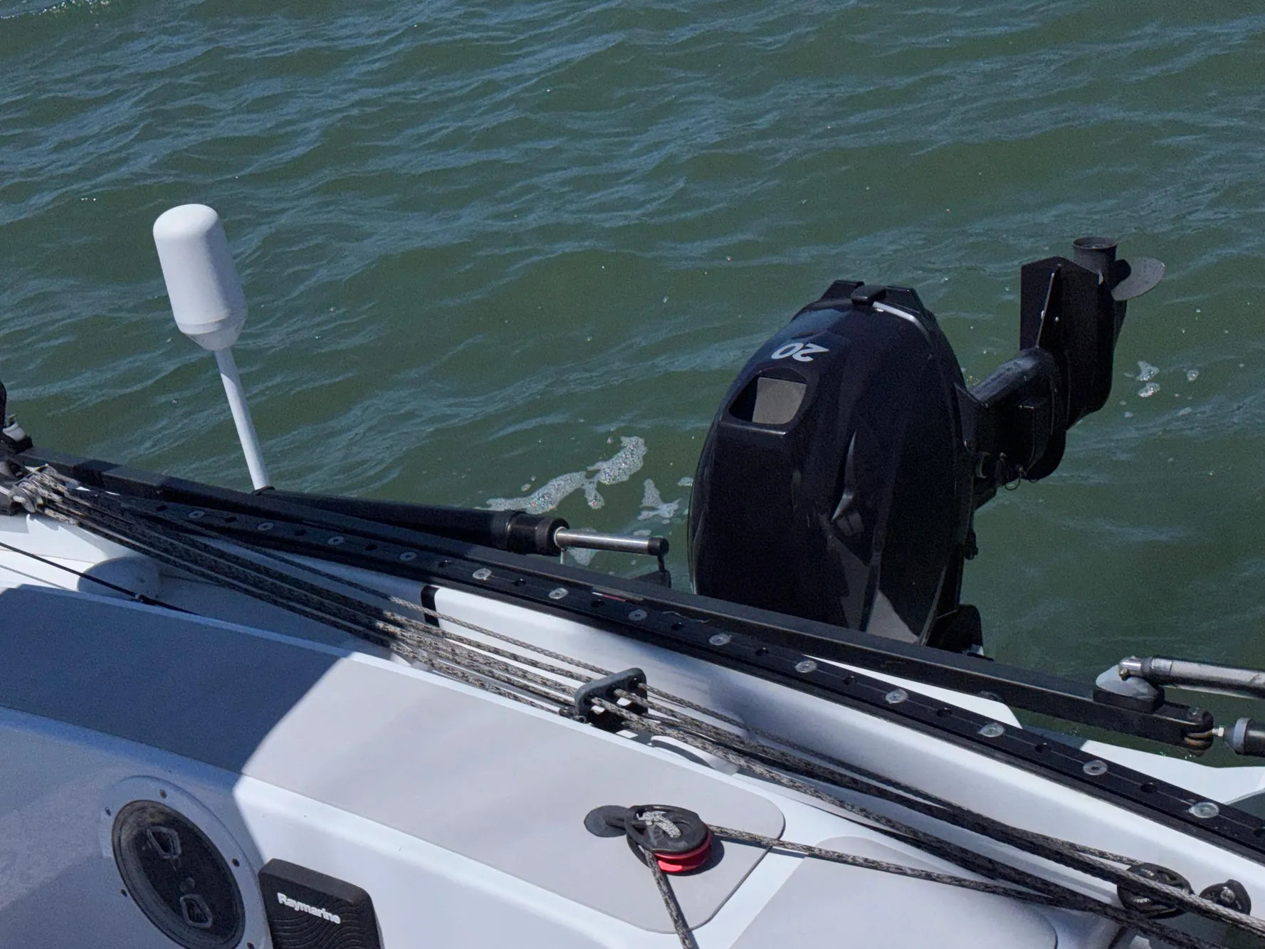 Marstrom Seacart 30 sailboat with outboard motor on water, 2015 model.