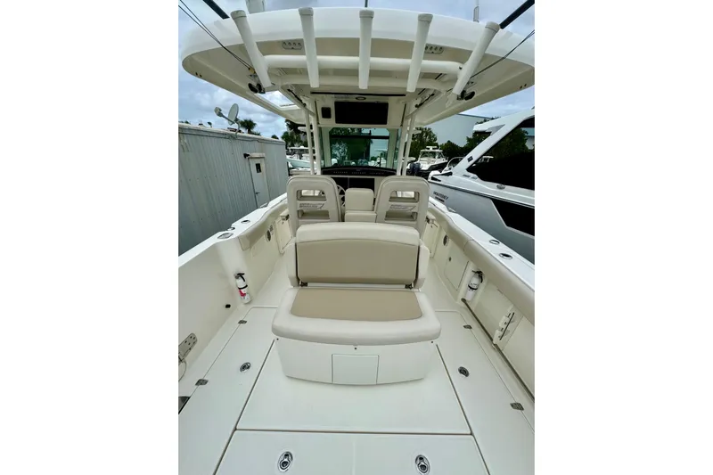 Overtime Yacht Photos Pics 2018 Boston Whaler 330 Outrage boat interior with seating and storage compartments.