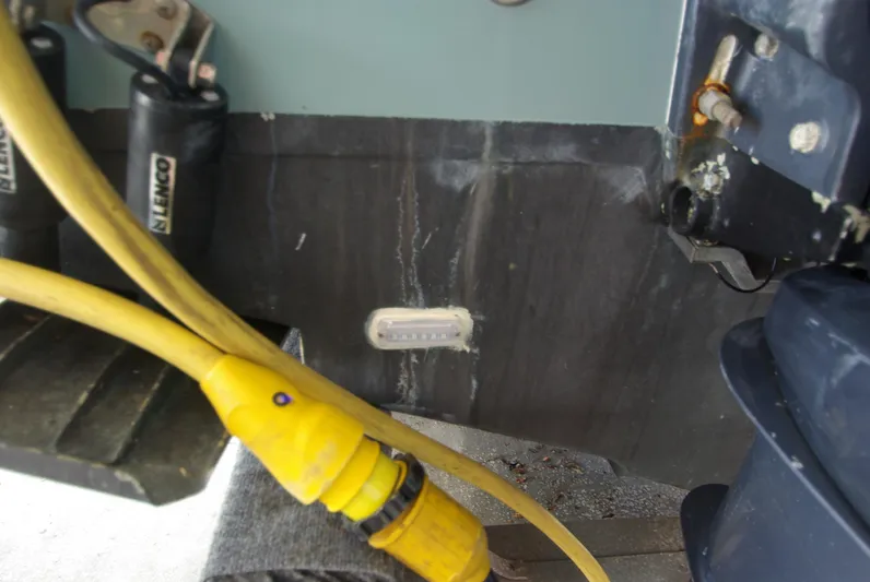  Yacht Photos Pics Close-up of 2019 Sailfish 325 Dual Console boat's engine area with yellow cables.