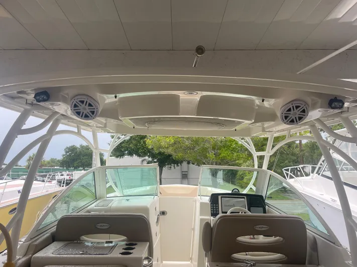  Yacht Photos Pics 2019 Sailfish 325 Dual Console boat interior with seating and navigation equipment.