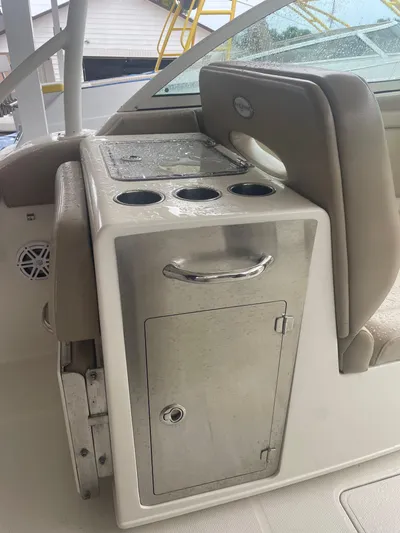 Yacht Photos Pics 2019 Sailfish 325 Dual Console boat interior with cup holders and storage compartment.